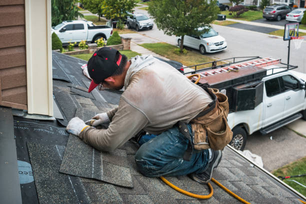 Professional Emergency Roof Repair technician working in Marshalltown, IA